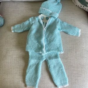 Hand knitted baby outfit